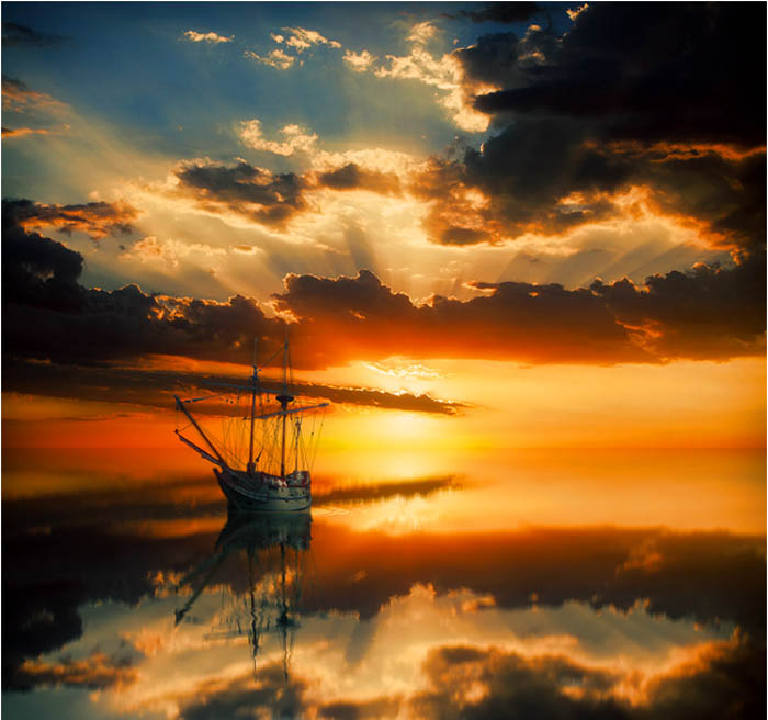Парусная лодка будто парит между небом и землей на фотографии Питера Фрома.