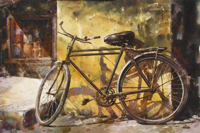 Велосипед у стены.