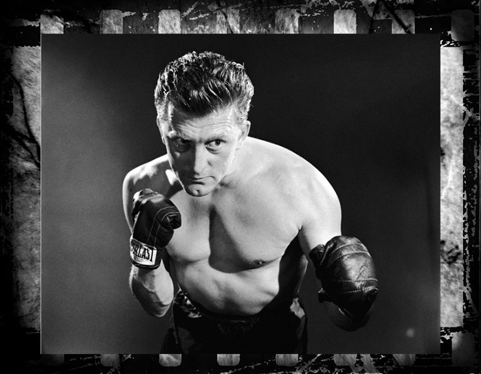 Кирк Дуглас на рекламном плакате фильма «Чемпион» режиссёра Марка Робсона, 1949 год.