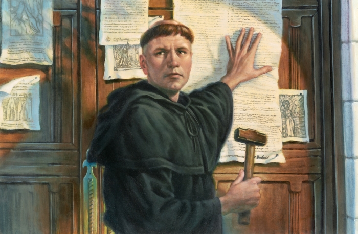 Изображение Мартина Лютера, прибивающего свои 95 тезисов к двери церкви. \ Фото: tinlanh.ru.
