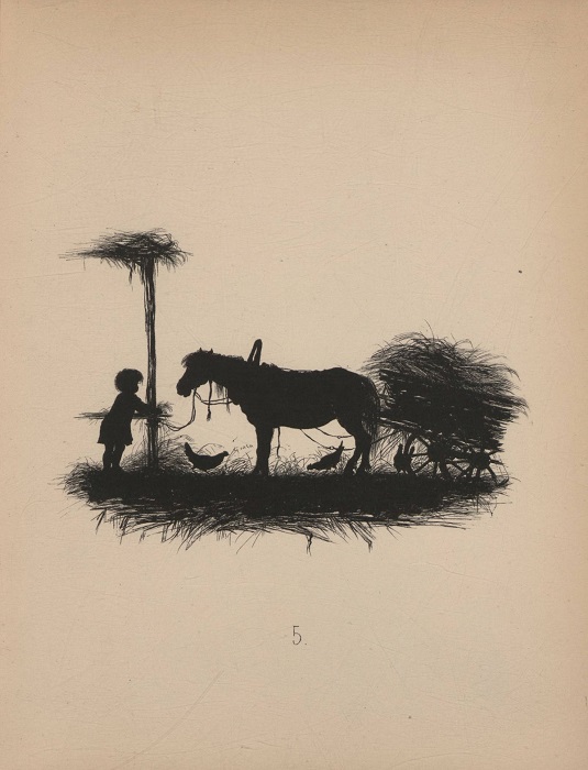 Мальчишка кормит лошадь.