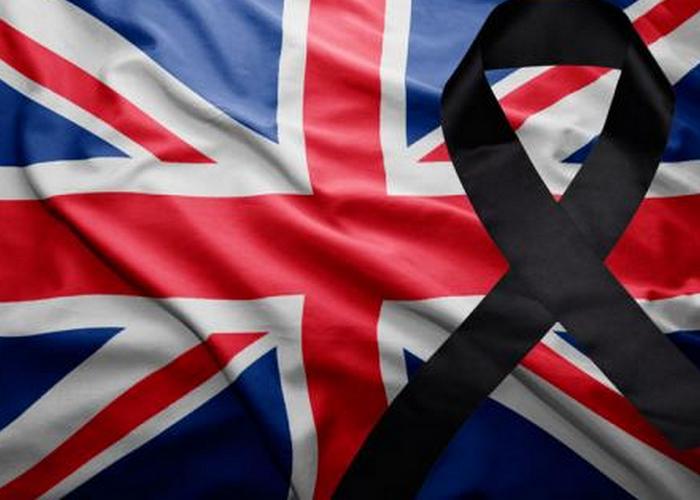 Флаг Великобритании с черной траурной лентой./ Фото: censor.net.ua