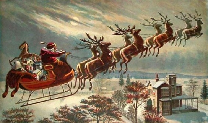 Санта Клаус на оленях.