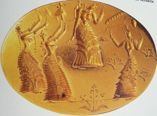 Золотая печатка с изображением танцовщиц.